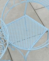 Close up of intricate seat detail on patio two seater bistro set Close up of intricate seat detail on patio two seater bistro set