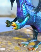 Close up of Blue Metal Baby Dragon Garden Sculpture 