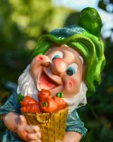 Close up of intricate detail on colourful garden gnome ornament