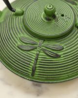 Close Up of Dragonfly Embossed Patten on Green and Black Teapot 