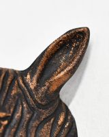 Close up of intricate ears detail on copper animal head wall bust