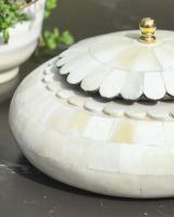 Close up of intricate scalloped edge detailing on trinket bowl