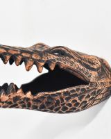 Close up of intricate eye detail on cast aluminium copper animal head bust