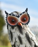Close up of face detail on hand-painted patio sculpture