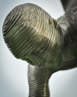 Close up of abstract face detail on garden art sculpture Close up of abstract face detail on garden art sculpture