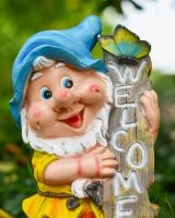 Close up of intricate detail on colourful garden gnome sculpture