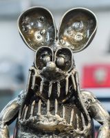 Close up of face detail on recycled metal art sculpture Close up of face detail on recycled metal art sculpture