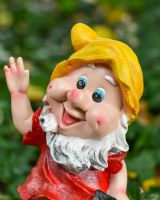 Close up of intricate face detail on garden gnome sculpture