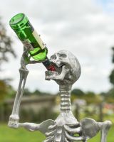 Close up of drinking skeleton garden ornament