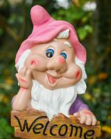 Close up of intricate face detail on colourful garden gnome Close up of intricate face detail on colourful garden gnome