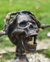 Close up of intricate skull detail on skeleton garden sculpture