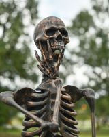 Close up of intricate face detail on skeleton garden sculpture