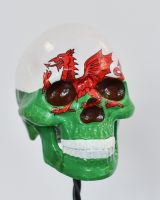 Close up of handpainted detail on welsh flag skull ornament