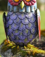 Close up of feather detail on colourful steel outdoor sculpture