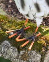 Close up of feet detail on steel owl garden ornament