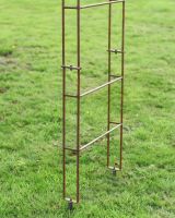 Close up of feet and fixings on rustic finish garden rose arch Close up of feet and fixings on rustic finish garden rose arch
