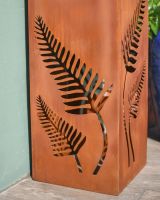 Close up of intricate fern detail on decorative garden column