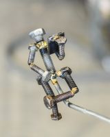 Close up of figure detail on scrap metal home decor sculpture Close up of figure detail on scrap metal home decor sculpture