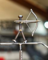 Close up of archer figure on scrap metal art sculpture Close up of archer figure on scrap metal art sculpture