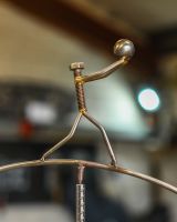 Close up of figure on scrap metal home decor sculpture