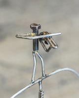 Close up of figure playing violin on scrap metal art sculpture