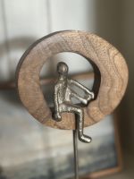 Close up of silver figure on home decor art sculpture