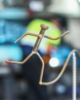 Close up of running figure on scrap metal art sculpture