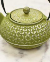 Close up of Green and Silver Embossed Cast Iron Teapot 