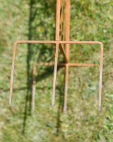 Close up of ground spike detail on Rustic Monstera Leaf Decorative Garden Screen Close up of ground spike detail on Rustic Monstera Leaf Decorative Garden Screen