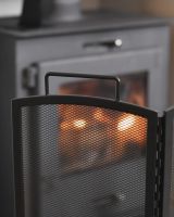 Close up of mesh detail and handle on belmont black fire guard Close up of mesh detail and handle on belmont black fire guard