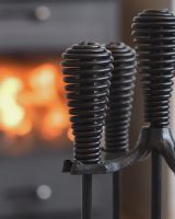 Close up of intricate handle detail on fireside companion set