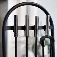 Close up of curved top of modern fireside companion set Close up of curved top of modern fireside companion set