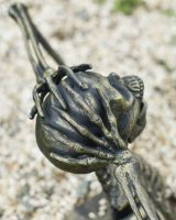 Close up of intricate hand detail on screaming skeleton garden sculpture