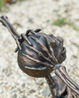 Close up of intricate hand detail on skeleton garden ornament
