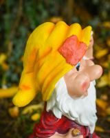 Close up of intricate hat detail on colourful garden gnome sculpture Close up of intricate hat detail on colourful garden gnome sculpture