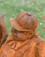 Close up of rustic hat detail on tweedledee and tweedledum patio statues Close up of rustic hat detail on tweedledee and tweedledum patio statues