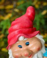 Close up of intricate hat detail on colourful outdoor gnome sculpture Close up of intricate hat detail on colourful outdoor gnome sculpture