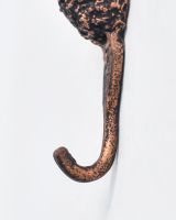 Close up of sturdy hook detail on animal head coat hook Close up of sturdy hook detail on animal head coat hook