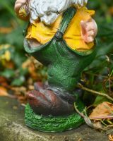 Close up of intricate detail on colourful garden gnome ornament