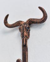 Close up of intricate skull and horn detail on Copper Longhorn Hook Close up of intricate skull and horn detail on Copper Longhorn Hook