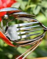Close up of intricate detail on recycled robin ornament