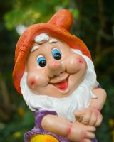 Close up of intricate face detail on colourful garden gnome