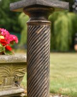 Close up of ornate twist detail on garden plinth