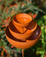 Close up of rustic rain catcher garden ornament Close up of rustic rain catcher garden ornament