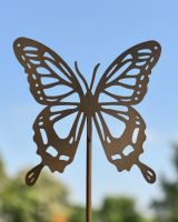 Close up of butterfly cut out detail on garden lawn spike