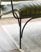 Close up of iron leg detail on Traditional Green Leather and Iron Two Seater Chair