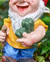Close up of gardening vegetable detail on colourful garden gnome sculpture