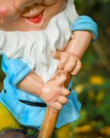 Close up of beard detail on colourful garden gnome ornament Close up of beard detail on colourful garden gnome ornament