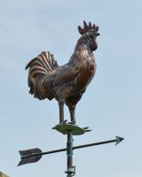 Close up of rooster on traditional weathervane Close up of rooster on traditional weathervane