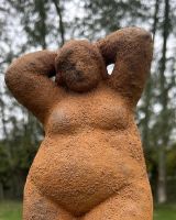 Close up of intricate detail on rustic finish garden statue Close up of intricate detail on rustic finish garden statue